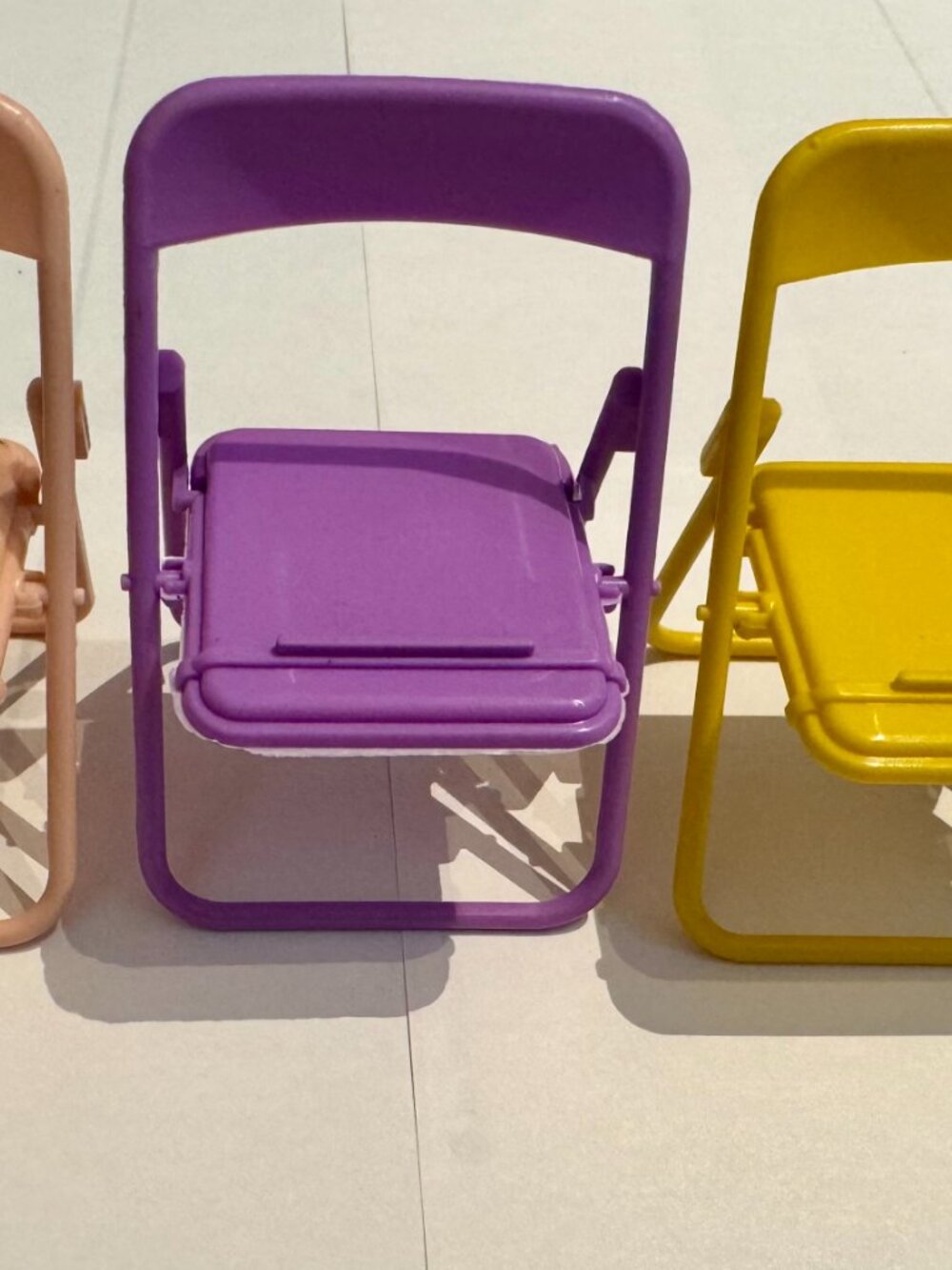 Purple Plastic Folding Chair Cell Phone Stand